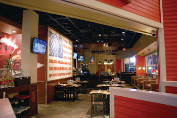 A large American flag is prominently displayed on the interior walls