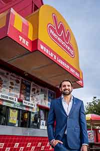 Galardi standing in front of Wienerschitzel restaurant