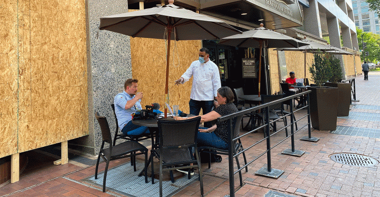 Diners-outside-a-boarded-up-restaurant.gif