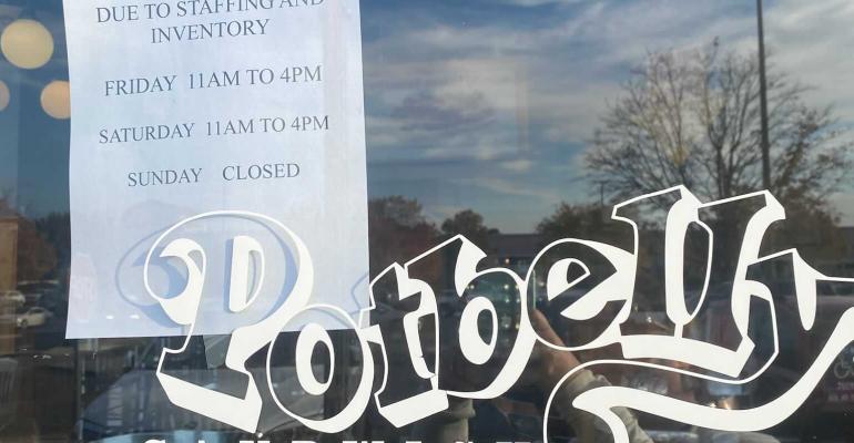 Sign showing Potbelly's reduced hours
