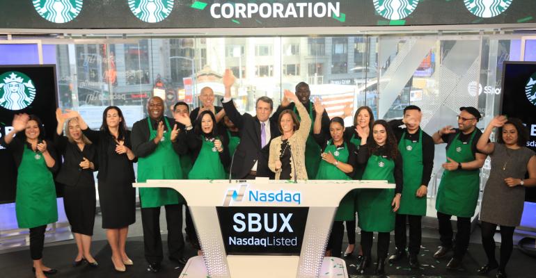 Starbucks employees ring the opening bell on the Nasdaq stock exchange Monday June 26.