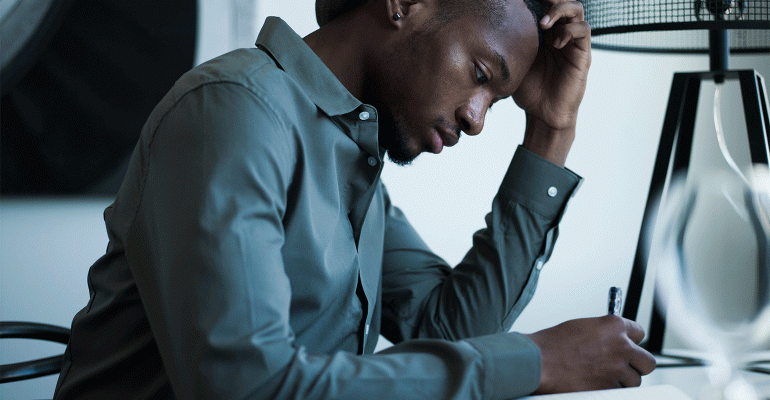 Man stressed at his desk