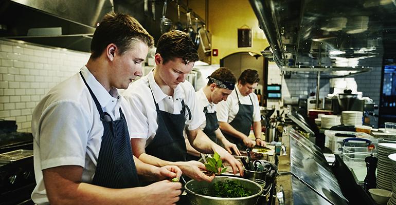 restaurant workers in a kitchen.jpg