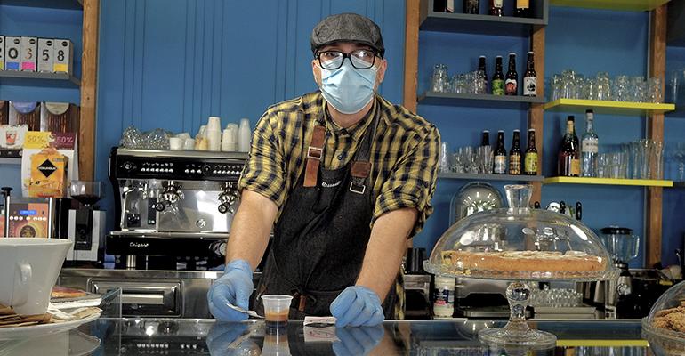 restaurant-worker-wearing-mask-reopening-post-coronavirus.jpg