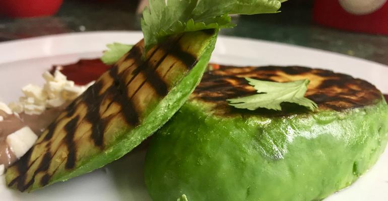 Chef Mario Hernandez uses a technique called nixtamalization to make an avocado “steak.”
