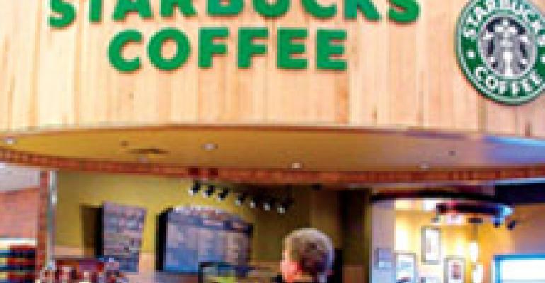 Starbucks scales back new stores, expects new drinks to perk up traffic