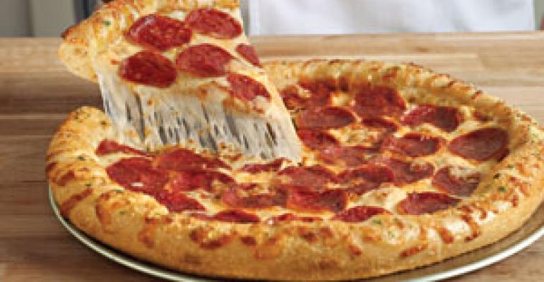 Domino’s new pizza delivers sales surge