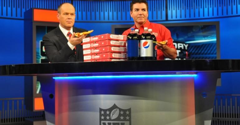 Papa Johns founder John Schnatter right promotes the new deal on the NFL Network with Rich Eisen