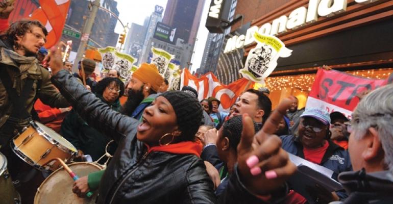 Protesters gather in front of a McDonalds in New York City
