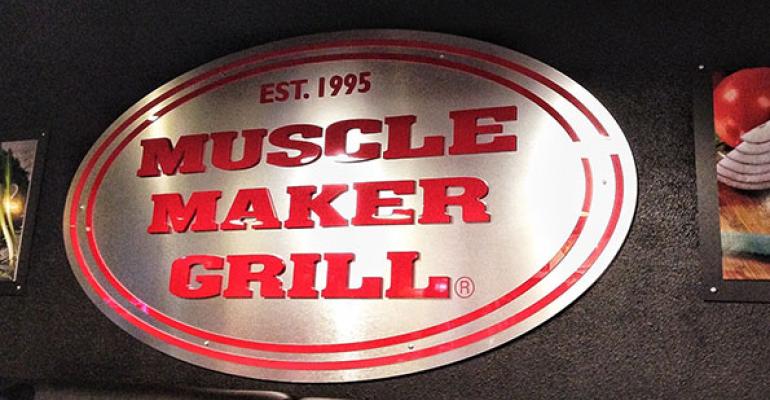 Muscle Maker Grill signage on interior wall