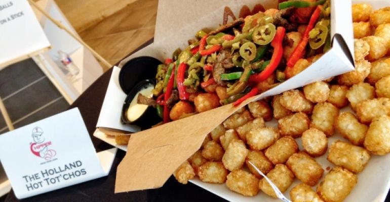 Texas Rangers pitcher Derek Holland has his name immortalized in the Holland Hot Totrsquochos menu introduction featuring tater tots a choice of chicken or steak sauteacuteed red and green bell peppers pickled jalapentildeos Buffalo sauce and spicy queso hollandaise served in a mini Dutch oven 1750