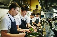 restaurant workers in a kitchen.jpg
