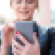 Woman looking at cell phone.png