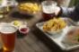 Craft beers accompany a Shack Burger and fries at Shake Shack