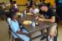 Corner Bakery team members and local schoolteachers help provide lunch to school children served during the summer months at St Agatharsquos Academy in Chicago