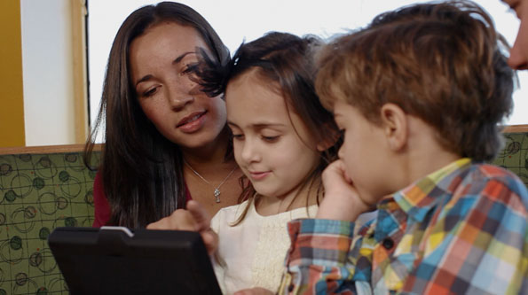 A family experiments with one of Applebee's new tablets